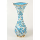 A continental blue glass vase, with white overlaid enamel and gilt leaf decoration, height 45cm,