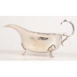 An Edwardian silver sauce boat on three acanthus leaf decorated paw feet, Birmingham 1904, 5oz.