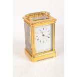 A good French gilt brass corniche cased carriage clock,