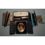 Fountain and other pens, a portrait, a naval two part buckle and a snake skin purse.