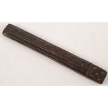 An unusual Islamic rectangular wooden carving, with calligraphy, length 21cm, width 3cm.
