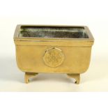 A Chinese polished bronze censer, of rectangular form, on four bracket feet, height 6.5cm, width 10.