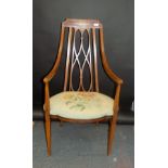 A mahogany and satinwood inlaid armchair, circa 1900, with a padded drop in seat, height 108cm.