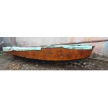 A plywood Classic sailing dinghy, length approximately 10' 6".