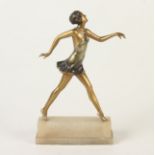 An Art Deco cold painted bronze figure of a dancing lady, on a stepped alabaster plinth,