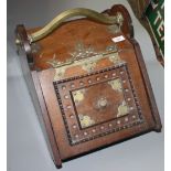 An Aesthetic Movement brass bound oak coal box, with a brass handle, height 38cm, width 34cm,