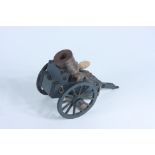 A scale model of a carronade with carriage.