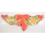 A plywood Christmas decoration of bows, width 100cm, maximum height 40cm.