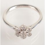 An 18ct white gold flowerhead diamond cluster ring, size M/N.