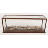 A mahogany display case, containing a quantity of wooden Millars Marine Models, height 17cm,
