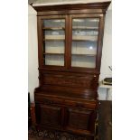A Edwardian walnut secretaire bookcase, with a pair of glazed doors,