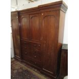 A Victorian mahogany breakfront triple wardrobe