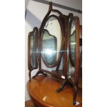 An Edwardian inlaid mahogany triple dressing table mirror.