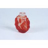 A clear and red glass carved overlay snuff bottle, with lion, phoenix and dragon, height 6.6cm.