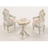 A Dresden style porcelain tripod table,