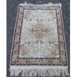 A Sparta rug, the ivory field with a central saffron medallion with flowering vines and leaves,