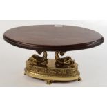 A gilt metal table tazza, 19th century, with an oval moulded mahogany top,