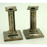 A pair of filled silver column candlesticks by Thomas A Scott, Sheffield 1899, height 13cm.