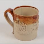 A salt glazed moulded mug, 19th century, height 8.5cm, diameter 7.5cm.