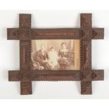 A maritime tramp art photograph frame, inscribed 1870 to reverse, 26.5 x 31cm.