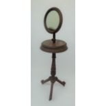 A late Victorian mahogany shaving stand, with angular tripod base,