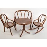 Bentwood dolls furniture comprising a circular centre table, height 27cm, diameter 27cm, a sofa,