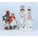 A Victorian Staffordshire group Darby and Joan, height 28 cm,