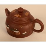 A Chinese Yixing teapot, the body decorated with ducks and calligraphy, seal mark to base,