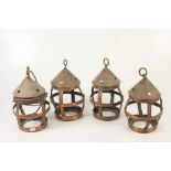 Four hanging copper lanterns, height 29cm.