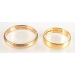 An 18ct gold band 2.9g, a 9ct gold band 3.8g.