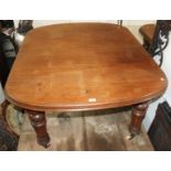 A Victorian mahogany extending dining table, with turned and fluted legs, height 72.