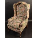 A hall porter's chair, with upholstered canopy and arms on cabriole legs.