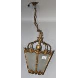 A gilt metal hanging lantern, with five glazed panels, height 33cm.