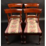 A set of four William IV mahogany dining chairs, each with a single horizontal bar splat,