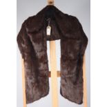 A chocolate brown fur stole, with dark brown silk lining, length (when worn) 68cm.