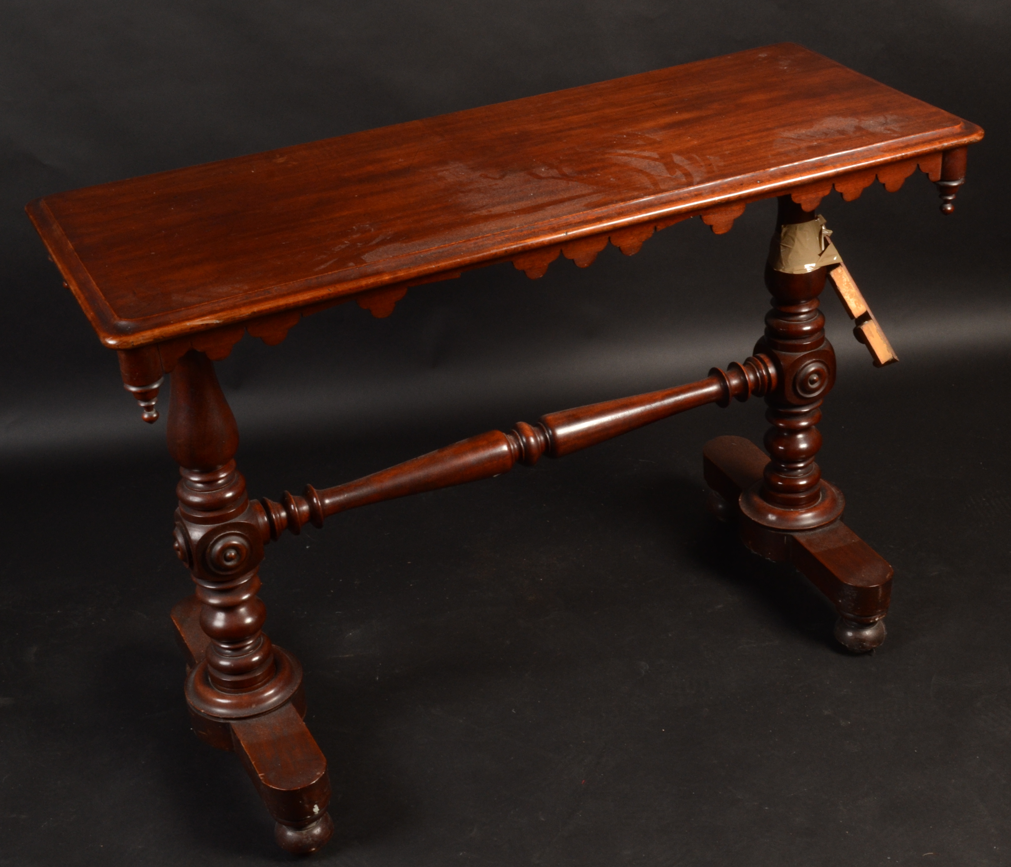 A Victorian mahogany narrow centre table, on turned supports, width 109cm.