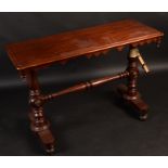 A Victorian mahogany narrow centre table, on turned supports, width 109cm.