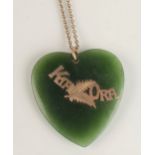 A New Zealand green stone large heart pendant with gold Kia Ora mount and on gold chain.