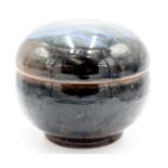 A Trevor Corser for Bernard Leach tenmoku glaze bowl and cover, height 18cm, diameter 20cm.