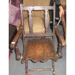 A rustic style oak armchair.