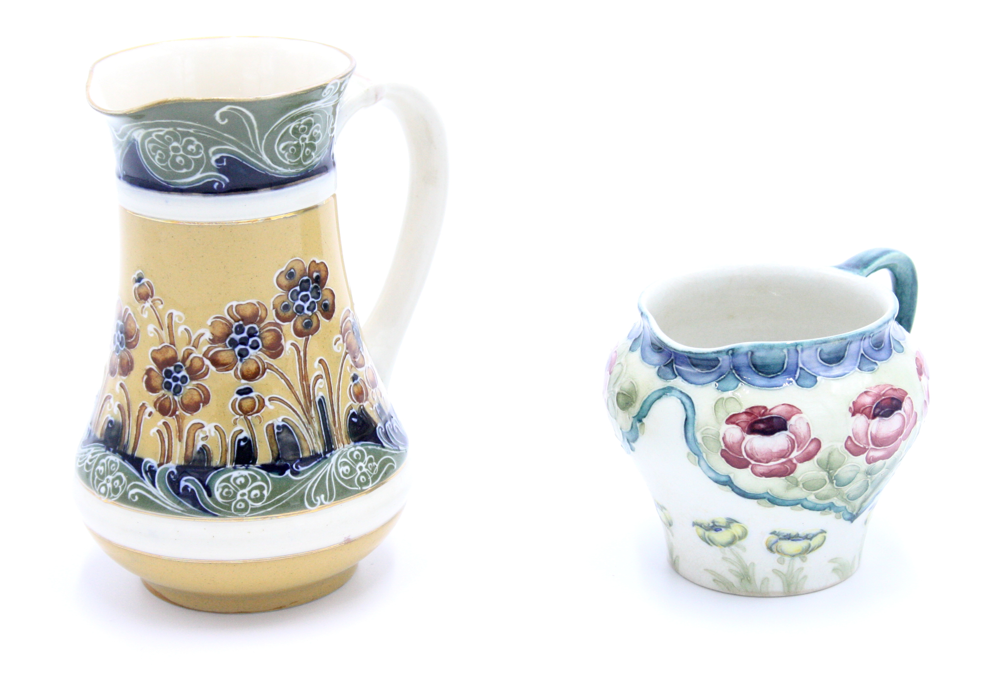 A Macintyre Moorcroft Florian style jug and one other Macintyre jug.