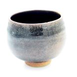 A Brett Guthrie tenmoku glaze tea bowl, personal and pottery marks, height 8.