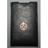 A 9ct gold Masonic fob and a Masonic booklet.