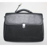 A Mandarina Duck locking briefcase, black leather upper and handle,