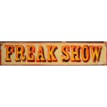 A 'Freak Show' sign 16 x 122cm.