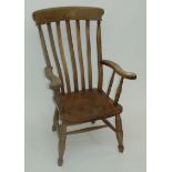 A Victorian lath back Windsor armchair.
