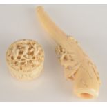 A Chinese carved ivory miniature box and a Chinese carved ivory cheroot holder.