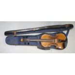 A cased violin, length of back 37cm.
