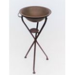 A folding metal campaign wash bowl on stand, height 80cm, diameter of bowl 37cm.