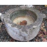 A large stone mortar, maximum width 56cm, height 31.5cm.